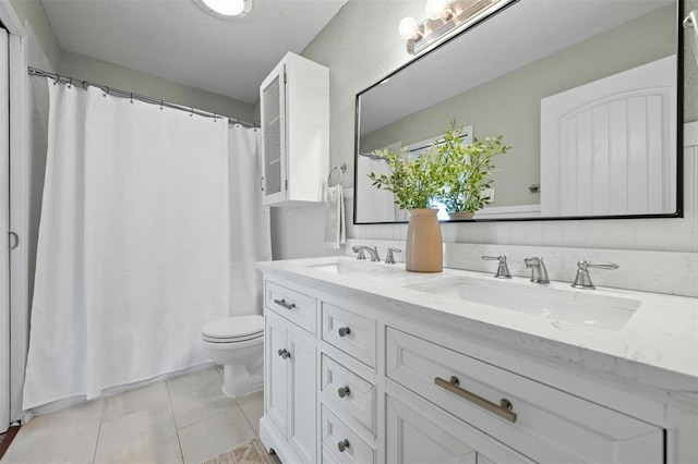 4610 S 1st St, Austin, TX 78745 - bathroom with double vanity, tile patterned flooring, and a shower with shower curtain