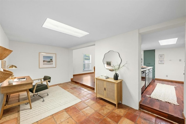 4610 S 1st St, Austin, TX 78745 - home office with a skylight and baseboards
