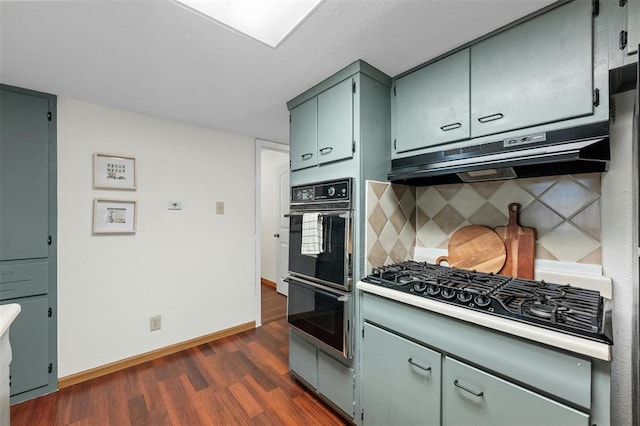 4610 S 1st St, Austin, TX 78745 - kitchen featuring black appliances, dark wood finished floors, under cabinet range hood, backsplash, and light countertops