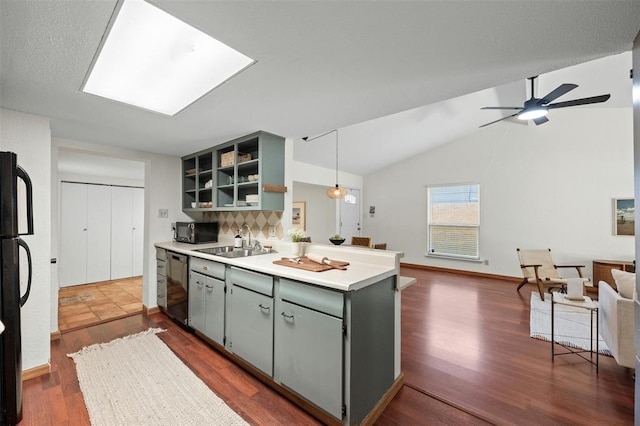 4610 S 1st St, Austin, TX 78745 - kitchen featuring black appliances, open floor plan, dark wood-type flooring, a peninsula, and open shelves