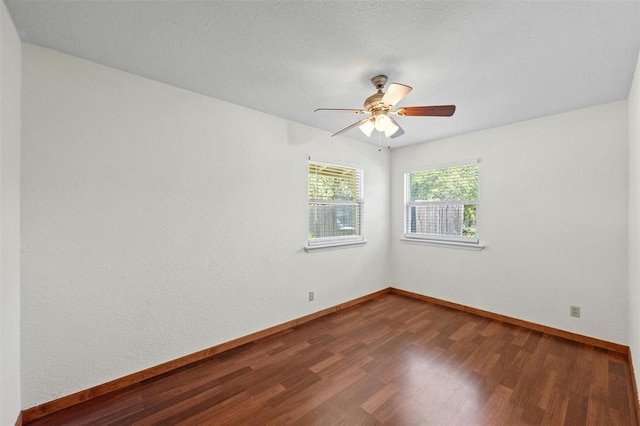 4610 S 1st St, Austin, TX 78745 - empty room with dark wood finished floors and ceiling fan