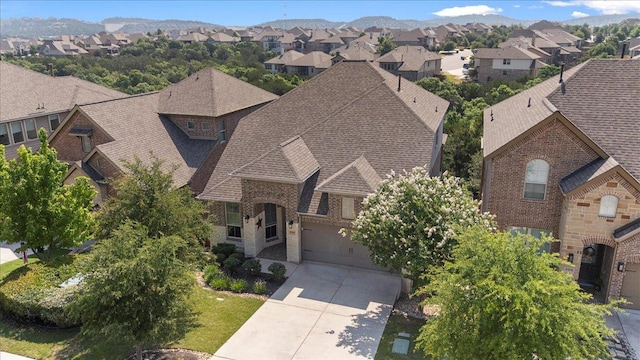 6500 Llano Stage Trl, Austin, TX 78738 - view of front facade with a residential view, concrete driveway, an attached garage, and roof with shingles