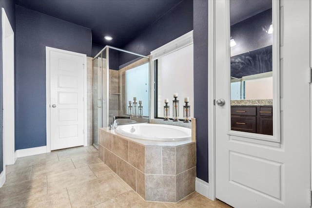 6500 Llano Stage Trl, Austin, TX 78738 - full bathroom featuring a garden tub, a shower stall, baseboards, and tile patterned flooring