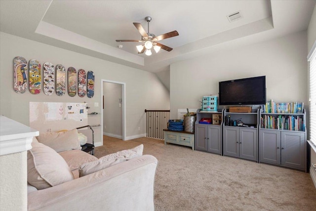 6500 Llano Stage Trl, Austin, TX 78738 - living area featuring a tray ceiling, ceiling fan, and carpet flooring