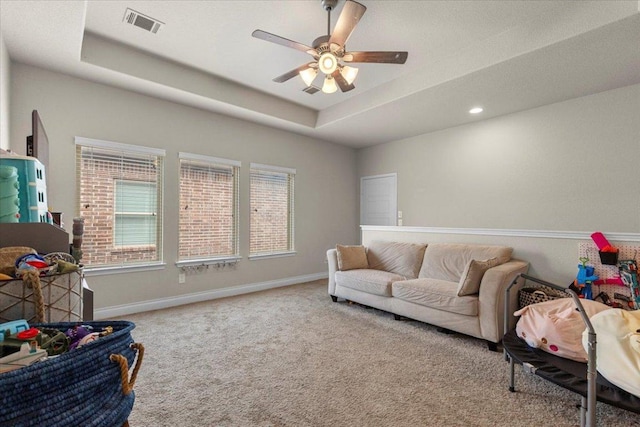 6500 Llano Stage Trl, Austin, TX 78738 - living area featuring carpet flooring, a raised ceiling, and a ceiling fan