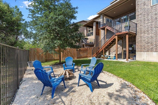 6500 Llano Stage Trl, Austin, TX 78738 - view of yard featuring an outdoor fire pit, stairs, a patio area, and a wooden deck