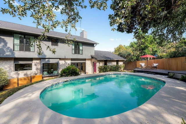 7302 Jester Blvd, Austin, TX 78750 - view of pool with a wooden deck and a fenced backyard