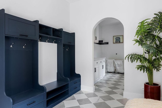 7302 Jester Blvd, Austin, TX 78750 - mudroom featuring light flooring, arched walkways, and baseboards