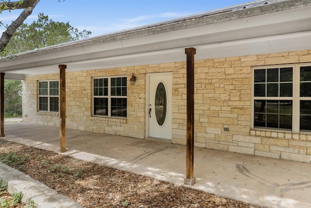 8281 Mountain Dr, Salado, TX 76571 - doorway to property with a patio and stone siding