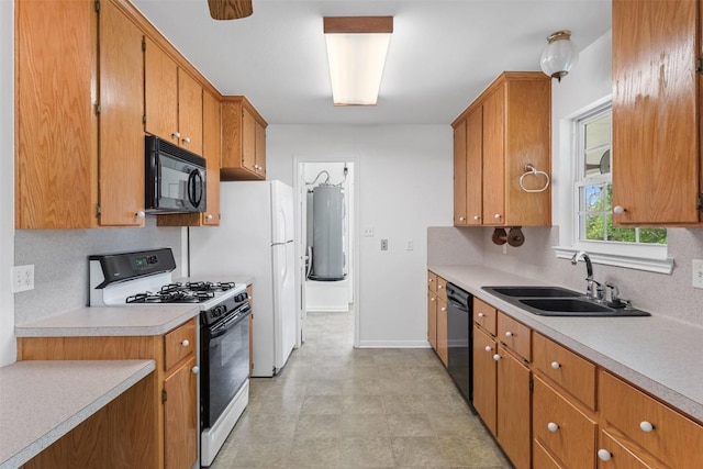 8281 Mountain Dr, Salado, TX 76571 - kitchen with black appliances, a sink, water heater, light countertops, and brown cabinetry