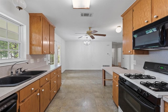 8281 Mountain Dr, Salado, TX 76571 - kitchen with black appliances, a sink, light countertops, and ceiling fan