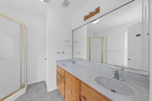 8281 Mountain Dr, Salado, TX 76571 - full bathroom featuring a stall shower, double vanity, tile patterned floors, and baseboards