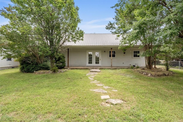 8281 Mountain Dr, Salado, TX 76571 - rear view of property featuring french doors and metal roof
