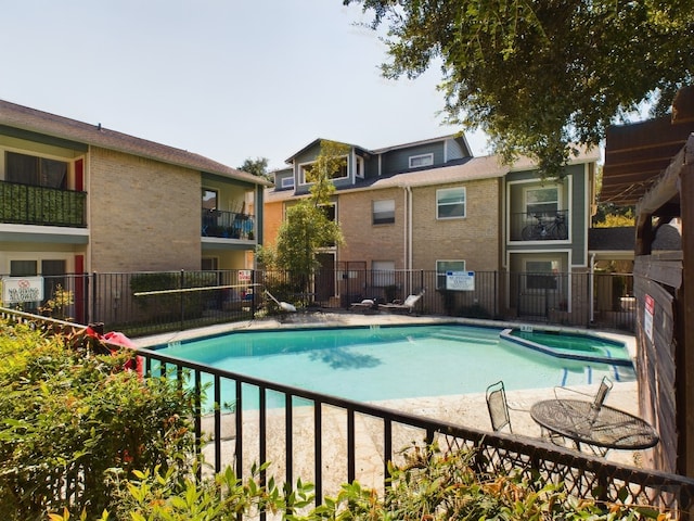 2104 Cullen Ave Unit 117, Austin, TX 78757 - view of swimming pool featuring a pool with connected hot tub