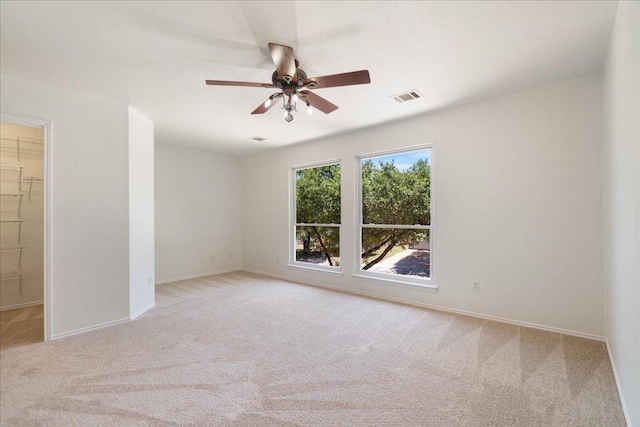 1025 Doras Dr, Pflugerville, TX 78660 - carpeted spare room with baseboards and ceiling fan