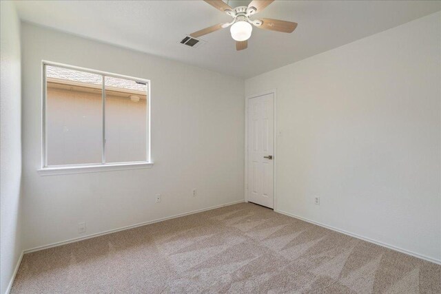 1025 Doras Dr, Pflugerville, TX 78660 - empty room featuring light carpet and a ceiling fan
