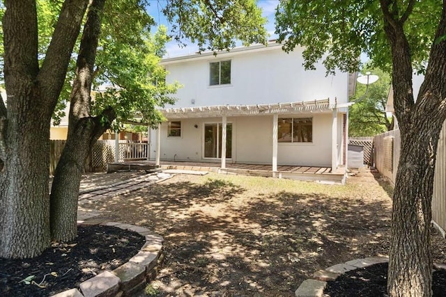 1025 Doras Dr, Pflugerville, TX 78660 - rear view of property featuring a pergola, a fenced backyard, stucco siding, and a patio area