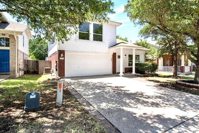 1025 Doras Dr, Pflugerville, TX 78660 - view of front of home featuring brick siding, concrete driveway, and an attached garage