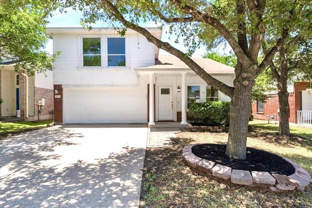 1025 Doras Dr, Pflugerville, TX 78660 - view of front of house with brick siding, an attached garage, and driveway