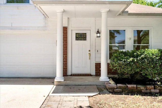 1025 Doras Dr, Pflugerville, TX 78660 - view of exterior entry featuring an attached garage