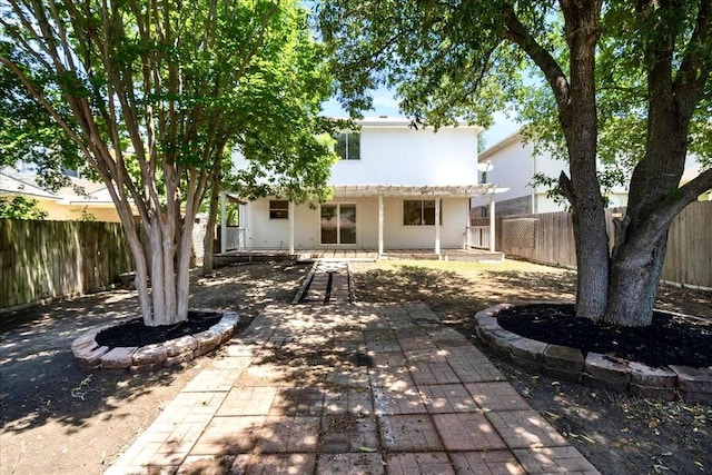 1025 Doras Dr, Pflugerville, TX 78660 - back of house featuring a patio, a fenced backyard, and a pergola