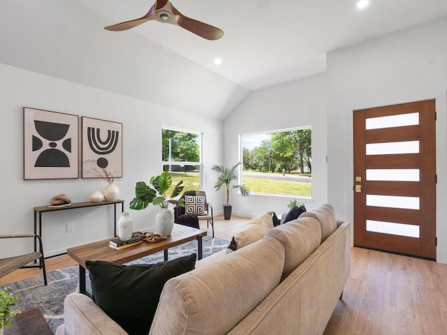2401 Lendall Ln, Austin, TX 78744 - living room with lofted ceiling, light wood-style floors, ceiling fan, and recessed lighting