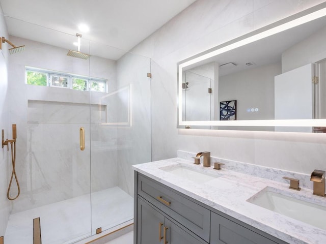 2401 Lendall Ln, Austin, TX 78744 - bathroom featuring a marble finish shower and double vanity