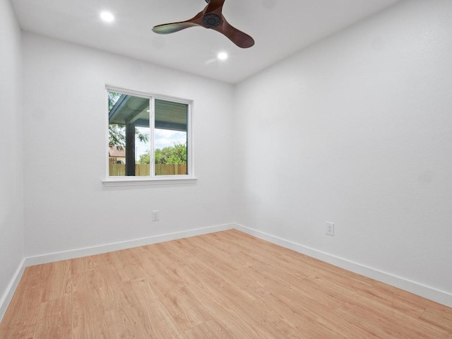 2401 Lendall Ln, Austin, TX 78744 - spare room with wood finished floors, ceiling fan, recessed lighting, and baseboards