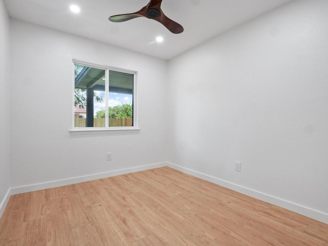 2401 Lendall Ln, Austin, TX 78744 - spare room with wood finished floors, ceiling fan, recessed lighting, and baseboards