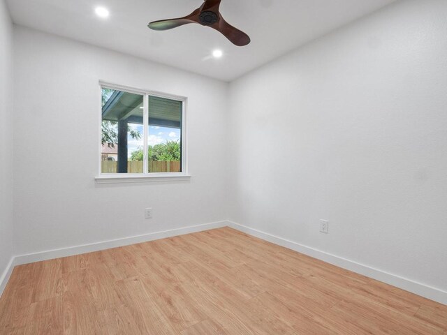 2401 Lendall Ln, Austin, TX 78744 - spare room featuring wood finished floors, ceiling fan, recessed lighting, and baseboards