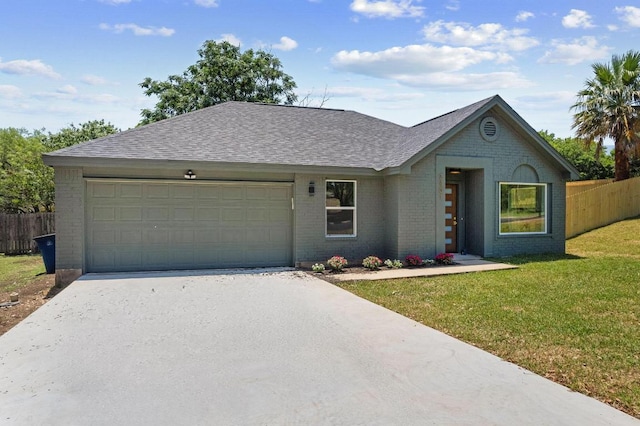 2401 Lendall Ln, Austin, TX 78744 - view of front facade with brick siding, a garage, driveway, and a shingled roof