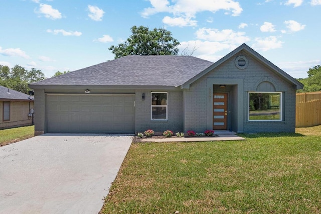 2401 Lendall Ln, Austin, TX 78744 - view of front facade featuring a garage, driveway, brick siding, and roof with shingles