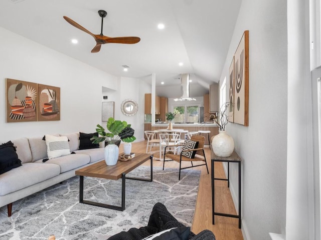 2401 Lendall Ln, Austin, TX 78744 - living area with wood finished floors, a ceiling fan, vaulted ceiling, and recessed lighting