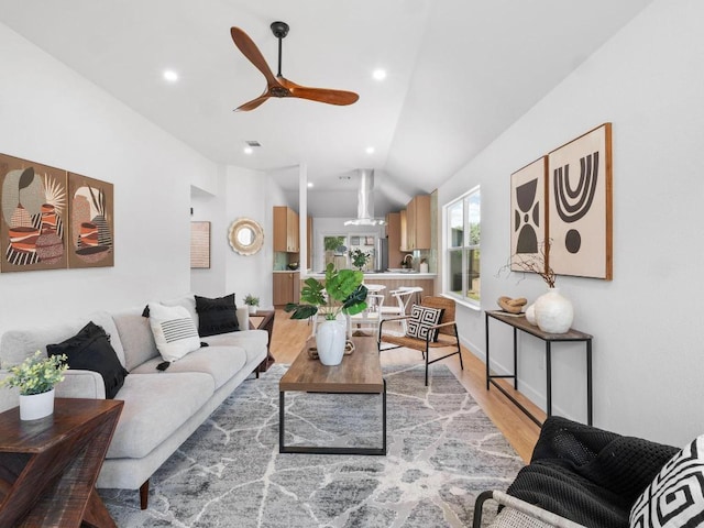 2401 Lendall Ln, Austin, TX 78744 - living room with a ceiling fan, light wood finished floors, vaulted ceiling, and recessed lighting