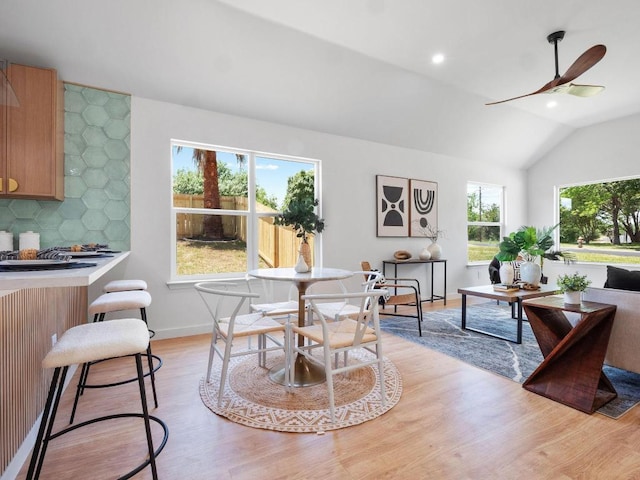 2401 Lendall Ln, Austin, TX 78744 - dining area featuring light wood-type flooring, ceiling fan, vaulted ceiling, baseboards, and recessed lighting