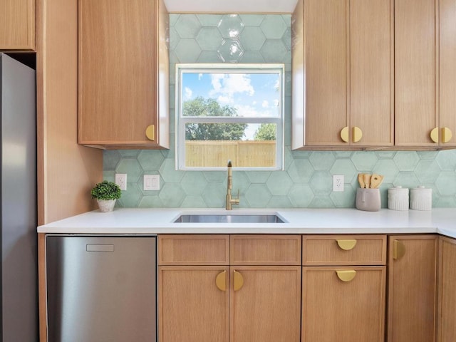 2401 Lendall Ln, Austin, TX 78744 - kitchen featuring a sink, freestanding refrigerator, light countertops, decorative backsplash, and fridge