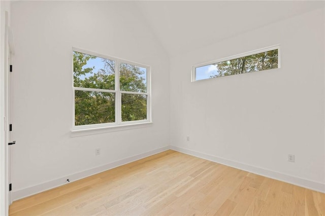 3321 Hemlock Ave Unit 2, Austin, TX 78722 - empty room with light wood-style flooring and lofted ceiling