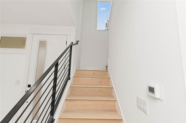 3321 Hemlock Ave Unit 2, Austin, TX 78722 - stairs featuring baseboards and wood finished floors