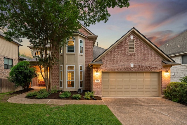 13129 Halsell Dr, Austin, TX 78732 - traditional home with brick siding, driveway, and an attached garage