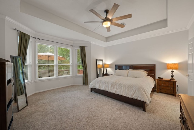 13129 Halsell Dr, Austin, TX 78732 - bedroom with a tray ceiling, light colored carpet, baseboards, crown molding, and ceiling fan