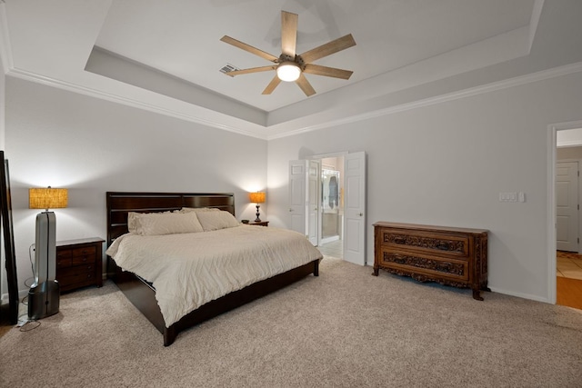 13129 Halsell Dr, Austin, TX 78732 - bedroom featuring a tray ceiling, carpet, ornamental molding, a ceiling fan, and ensuite bath