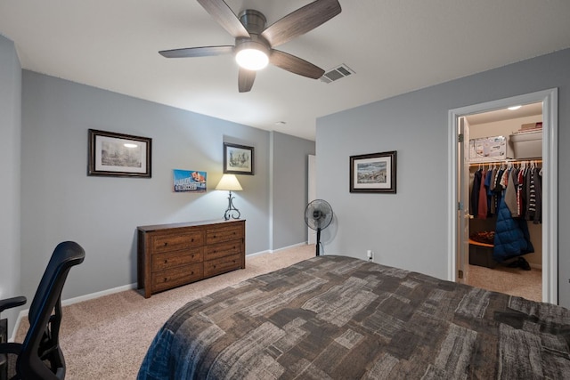 13129 Halsell Dr, Austin, TX 78732 - carpeted bedroom featuring a walk in closet, ceiling fan, and a closet