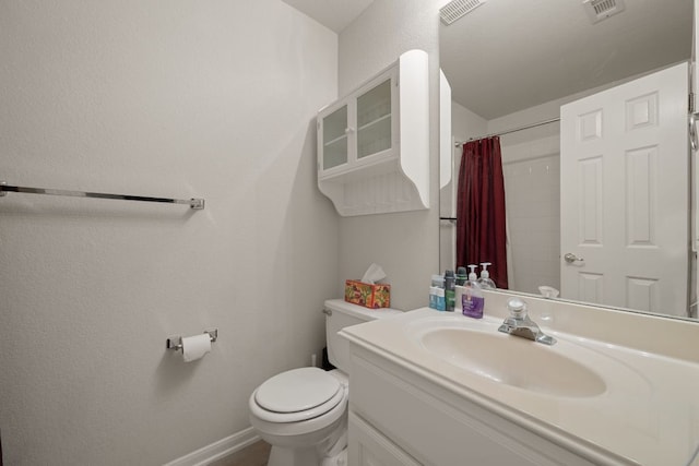 13129 Halsell Dr, Austin, TX 78732 - full bath featuring toilet, vanity, a shower with shower curtain, and baseboards