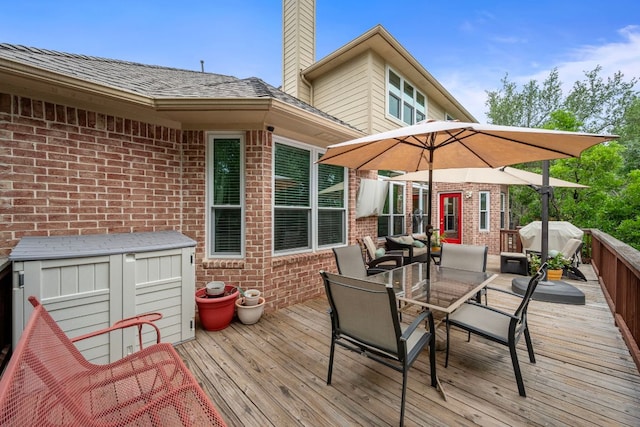 13129 Halsell Dr, Austin, TX 78732 - wooden terrace with outdoor dining area and a grill