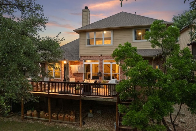 13129 Halsell Dr, Austin, TX 78732 - back of house featuring brick siding, a chimney, a deck, and a shingled roof