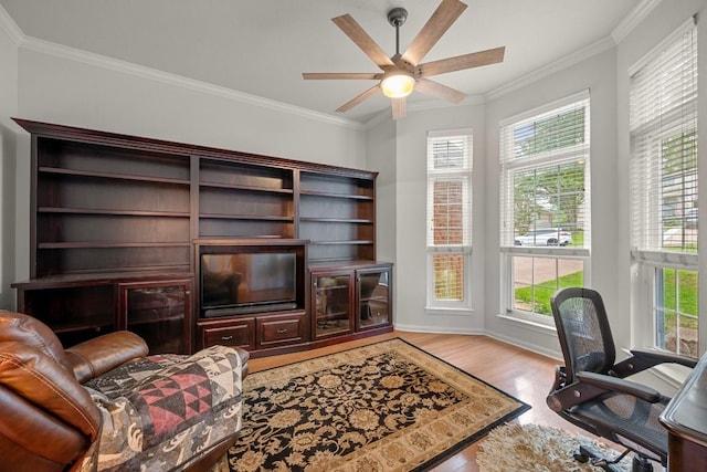 13129 Halsell Dr, Austin, TX 78732 - home office with wood finished floors, crown molding, ceiling fan, and baseboards