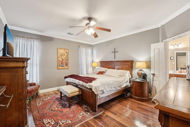 3822 Sky Ln, Round Rock, TX 78681 - bedroom with wood finished floors, ornamental molding, a ceiling fan, and baseboards