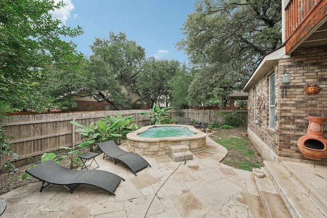3822 Sky Ln, Round Rock, TX 78681 - fenced backyard featuring an outdoor hot tub and a patio area