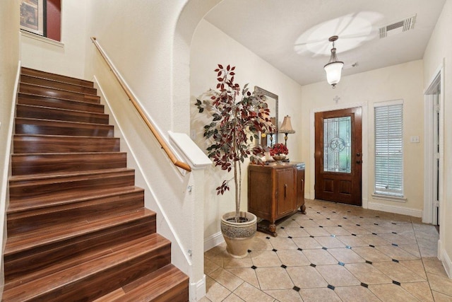 3822 Sky Ln, Round Rock, TX 78681 - entryway featuring stairs, arched walkways, and baseboards