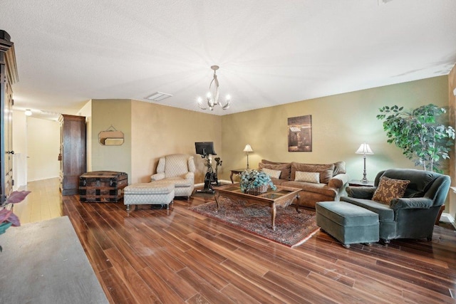 3822 Sky Ln, Round Rock, TX 78681 - living room featuring wood finished floors and a chandelier